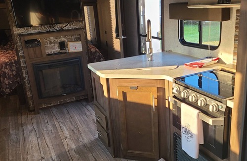 Suamico RV Rental | NFL Draft Glamping with Indoor Fireplace
