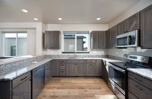 Ennis House | North 40 Farmhouse with Game Garage!