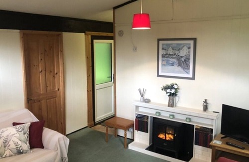 Cenarth House | Nuthatch Lodge is set in 24 acres of wood/parkland near the village of Cenarth