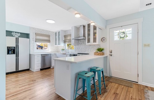 Long Beach House | Oak Island home on the Davis Canal with private boat dock.