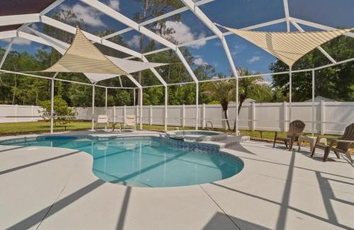 Palm Coast House | Oasis Heated Pool Spa Fenced Yard Bicycles