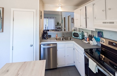 Avon House | OBX beach house with ocean views, decks, private hot tub, & seasonal pool access