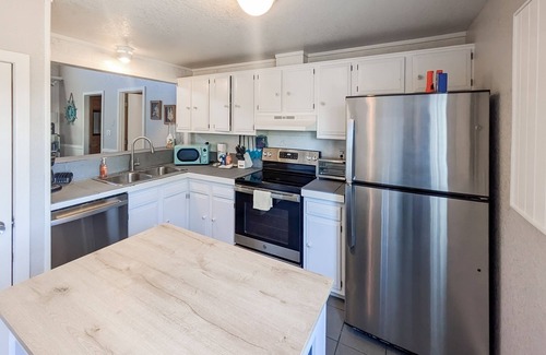 Avon House | OBX beach house with ocean views, decks, private hot tub, & seasonal pool access