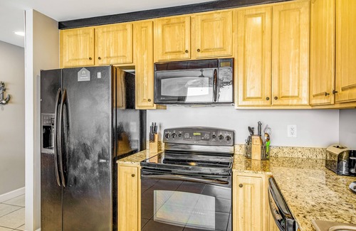 West Panama City Beach Condo | Ocean and breachfront condo with pool, gym, hot tub - walk to the beach