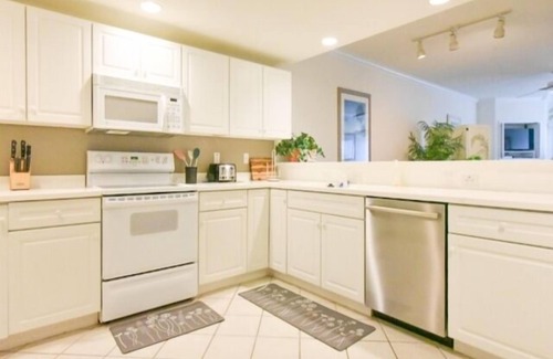 North Ocean City Condo | Ocean Block, porch, jacuzzi tub, indoor pool, sauna, gym! Steps from the beach!