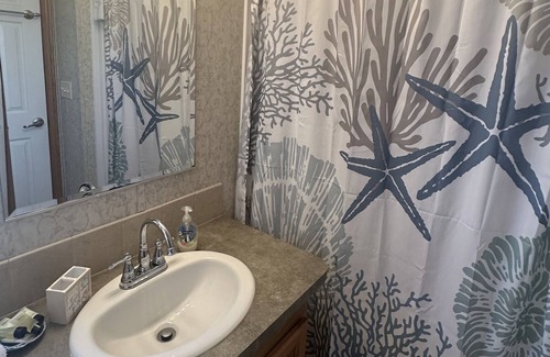 Snug Harbor House | Ocean directly outside your door in East Matunuck!