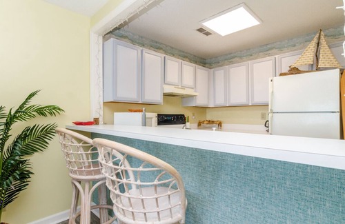 Kure Beach Condo | Ocean front ground level condo in the Riggings!