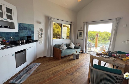 Isla Solarte House | Ocean Light Over Water Bungalow, Bedroom, King Bed, Living Room, Kitchenette