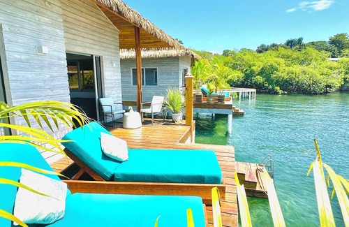 Isla Solarte House | Ocean Light Over Water Bungalow, Bedroom, King Bed, Living Room, Kitchenette