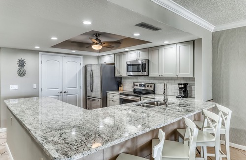 Holiday Isle Condo | Ocean-view condo with pool, sauna, tennis courts & private beach access