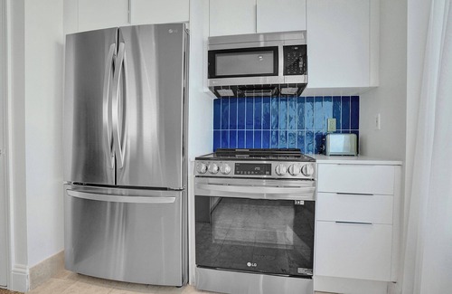 Mid Beach Condo | Ocean view corner suite. 2 Balconies, full kitchen, washer/dryer. No resort fee!