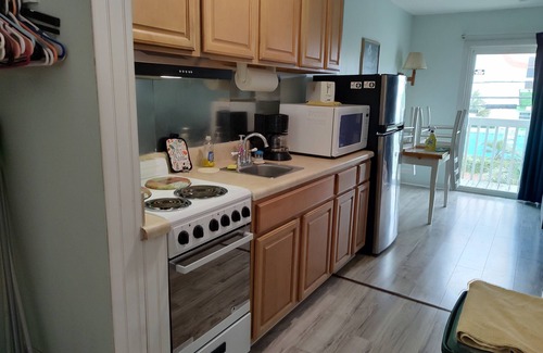 Wilmington Beach Condo | Ocean view, private balcony,pool,decked beach access 100 ft ,tiki bar across St