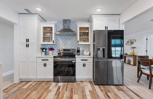Madeira Beach House | Oceanfront Getaway, boat dock with lift and dock - Heated pool is an option
