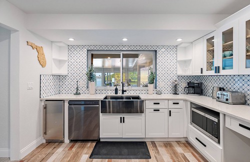 Madeira Beach House | Oceanfront Getaway, boat dock with lift and dock - Heated pool is an option