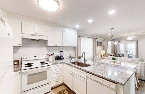 Crescent Beach Condo | Oceanfront retreat with a scenic balcony, W/D, and AC - beach and pool access