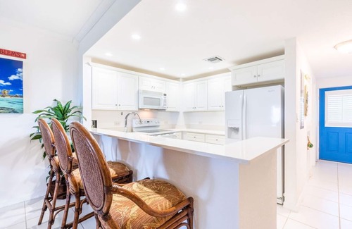 Rum Point Condo | Oceanfront right next to RumPoint, tranquility,pool,gym,tennis court and sunsets