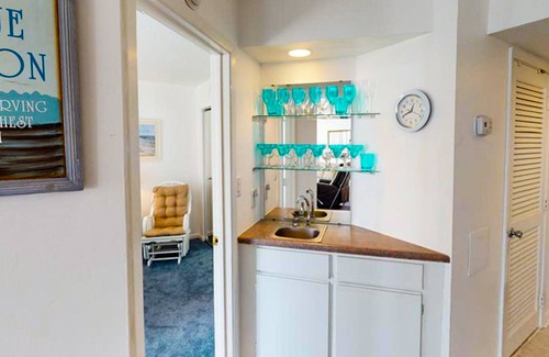 Sneads Ferry Condo | Oceanfront condo with a balcony with ocean & pool views, a gym & beach access