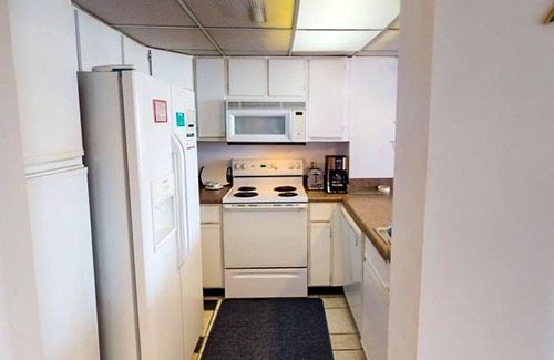 Sneads Ferry Condo | Oceanfront condo with a balcony with ocean & pool views, a gym & beach access