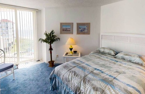 Sneads Ferry Condo | Oceanfront condo with a balcony with ocean & pool views, a gym & beach access