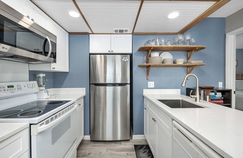 Saint Simons Island Condo | Oceanfront Condominium with Balcony, Pool and Boardwalk to Beach. Partial Ocean View