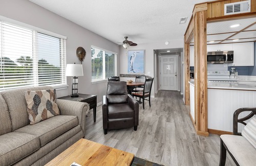 Saint Simons Island Condo | Oceanfront Condominium with Balcony, Pool and Boardwalk to Beach. Partial Ocean View