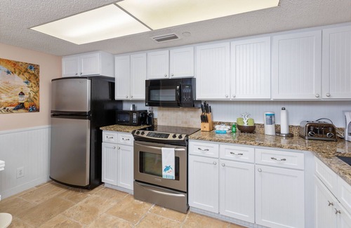 Saint Simons Island Condo | Oceanfront Condominium with pool, private boardwalk to beach with ramp.