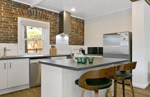 Moss Vale House | Old Bank Stables – north facing sun patio, outdoor furniture and BBQ