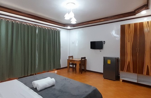 Catangnan Resort | One King Size Bed + Amenities