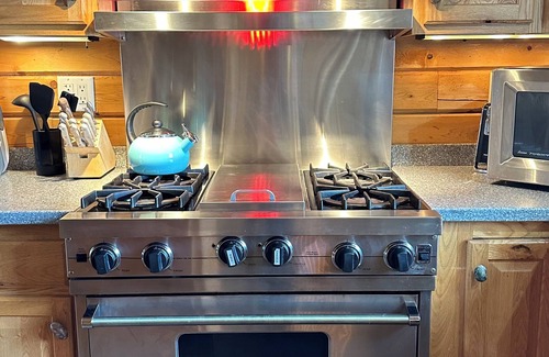 Skanee Cabin | One of a kind family retreat: lake front access, hot tub, sauna, and game room.