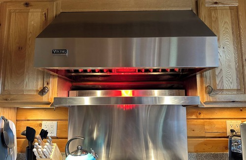 Skanee Cabin | One of a kind family retreat: lake front access, hot tub, sauna, and game room.