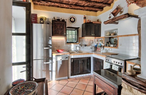Sant Miquel de Balasant Villa | Original restored stone-wood ibizan country villa with pool facing sunset.