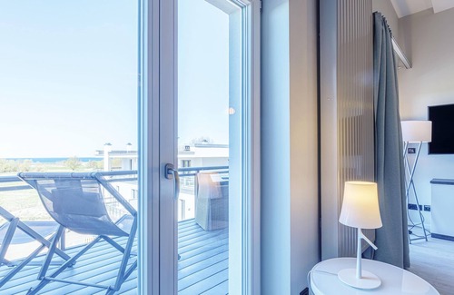Ostseebad Wustrow Apartment | Ostseerast vacation apartment with west-facing balcony in the Alte Seefahrtschule