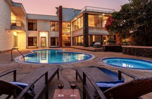 Nagaon Villa | Our Beloved Summer by StayVista - Offering a swimming pool, expansive lawn, badminton court and indoor games