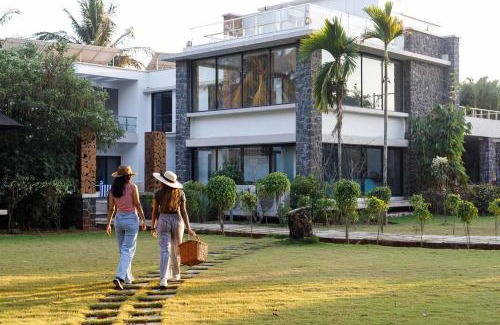 Nagaon Villa | Our Beloved Summer by StayVista - Offering a swimming pool, expansive lawn, badminton court and indoor games