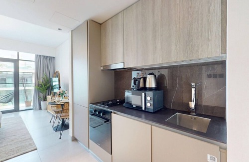 Jumeirah Village Apartment | Oxford Boulevard - BohoChic Studio with Pool View
