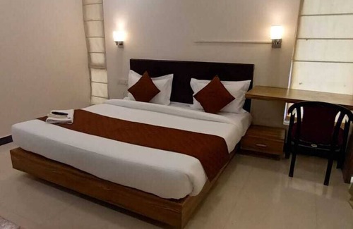 Jharsa Village Hotel | Pacific Inn Green