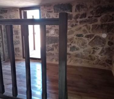 Omales House | panos stone tower