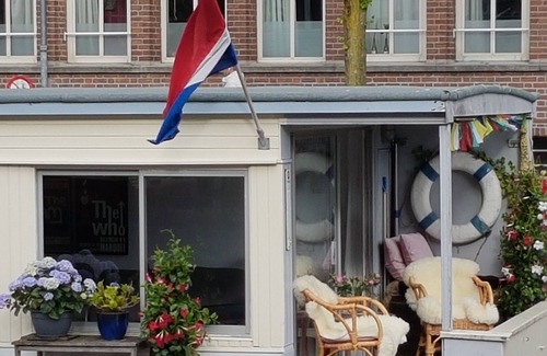 Grachtengordel-West Boat Rental | Pantheos Houseboat in Prinsengracht with a view of the Westerkerk the Landmark.