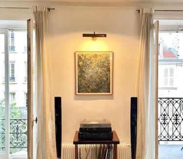 Quartier de Rochechouart Apartment | ParisHome! Double Balcony, Art & Designer Touches