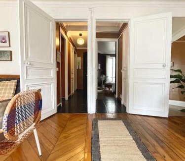 Quartier de Rochechouart Apartment | ParisHome! Double Balcony, Art & Designer Touches