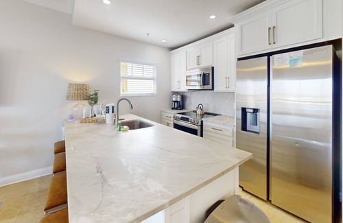 Treasure Island Condo | Partial Gulf View! Top Floor/Corner Unit. Watch dolphins from balcony. Great Views & Great Location!