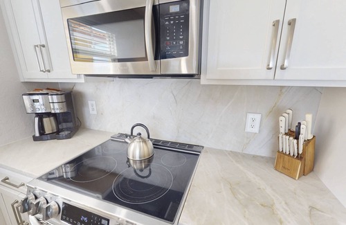 Treasure Island Condo | Partial Gulf View! Top Floor/Corner Unit. Watch dolphins from balcony. Great Views & Great Location!