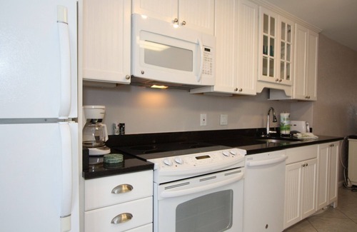 St. Pete Beach Condo | Patio Area - Walk to Beaches Shops & Restaurants