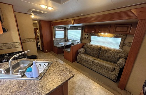 Mountain View House | Payne Lake Wilderness Huts - Camper A18n A cozy camper near a quiet lake!