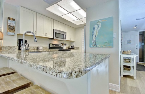 Madeira Beach Condo | Peaceful beachfront escape w/private balcony, heated pool, pool spa, BBQ grills