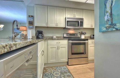 Madeira Beach Condo | Peaceful beachfront escape w/private balcony, heated pool, pool spa, BBQ grills