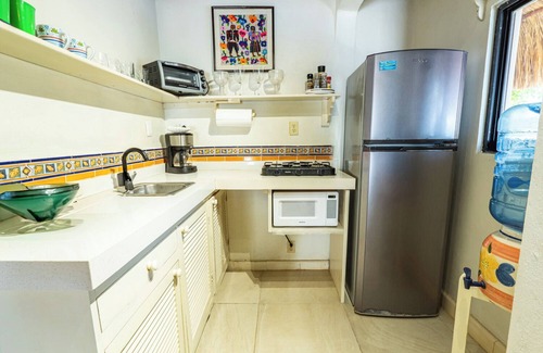 Isla Mujeres Cottage | Peaceful cottage on the beach,heated pool, tropical gardens and sunsets