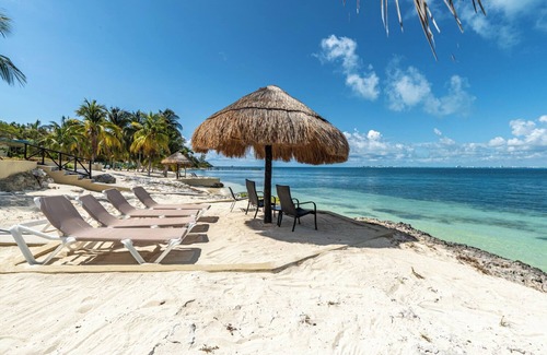 Isla Mujeres Cottage | Peaceful cottage on the beach,heated pool, tropical gardens and sunsets