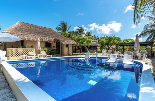 Isla Mujeres Cottage | Peaceful cottage on the beach,heated pool, tropical gardens and sunsets