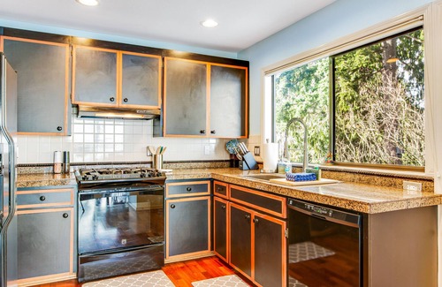 Bonney Lake House | Peaceful lakefront home with firepit, hot tub, pool table, dock, balcony, & deck